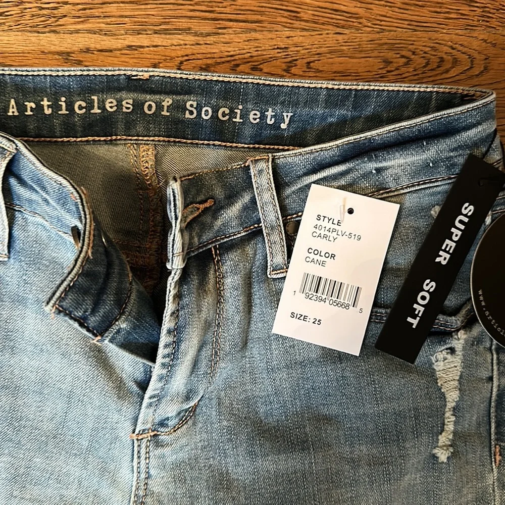 New with tags, light blue distress jeans - Picture 2 of 4
